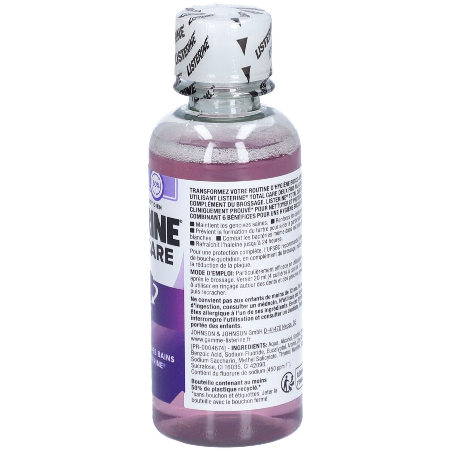 Achterkant mondspoelfles. Listerine Total Care. Tekst, ingrediënten en instructies. Paarse vloeistof.