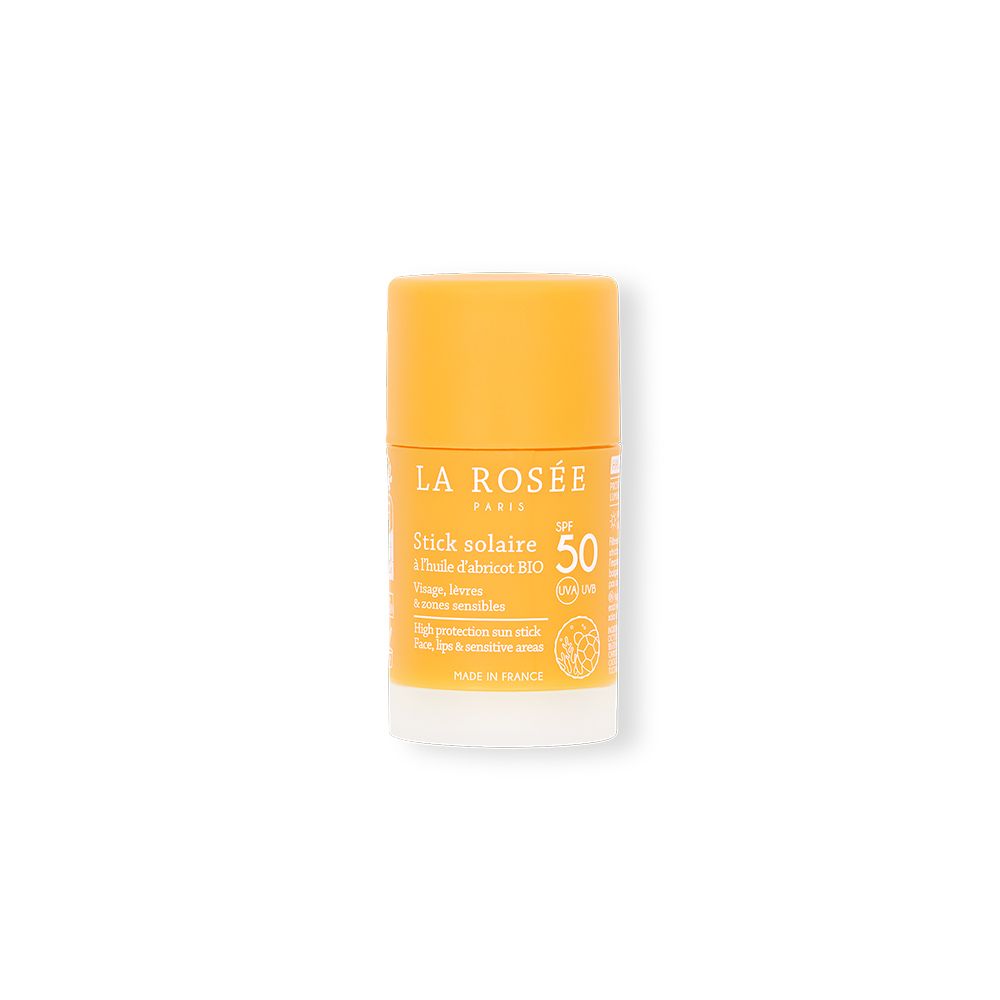 Stick solaire SPF 50. Bâton jaune avec base blanche. Texte: La Rosée, Stick solaire, SPF 50, à l'huile d'abricot BIO.