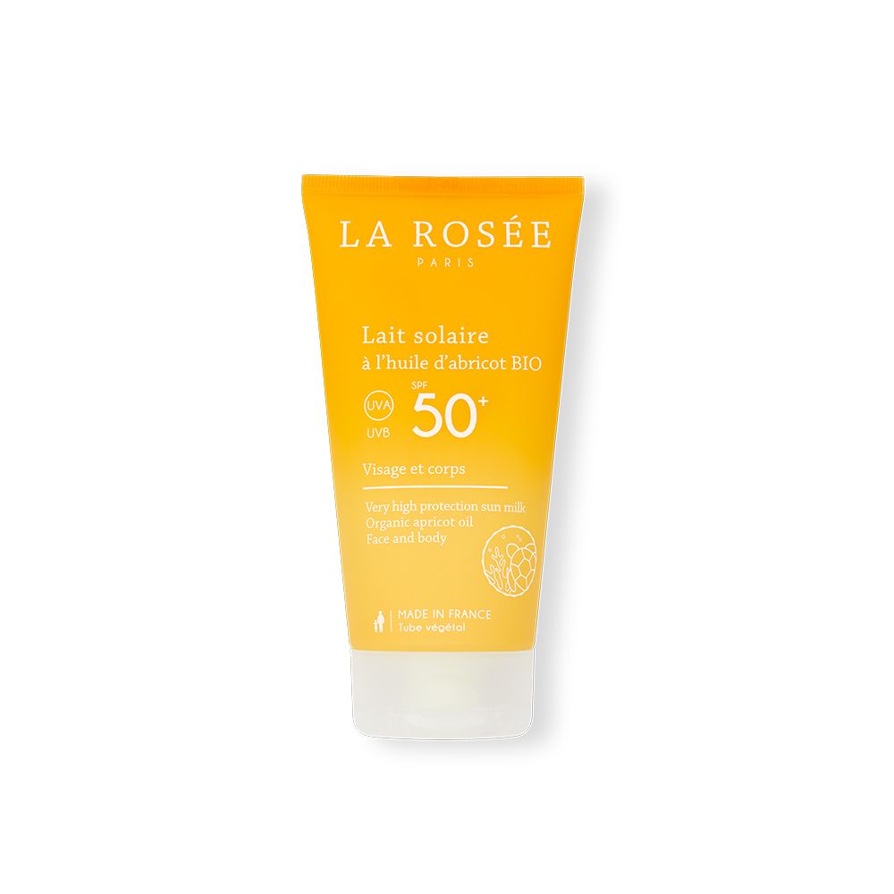 Gele tube met LA ROSÉE Lait solaire SPF 50+. Franse tekst. Bio abrikozenolie. Voor gezicht en lichaam.