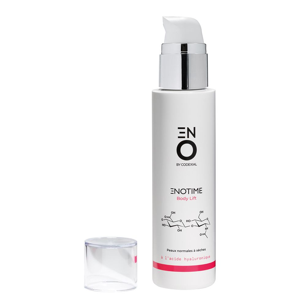 Flacon blanc avec pompe argentée et bouchon enlevé. Inscription : ENO by Coderal, Enotime Body Lift.