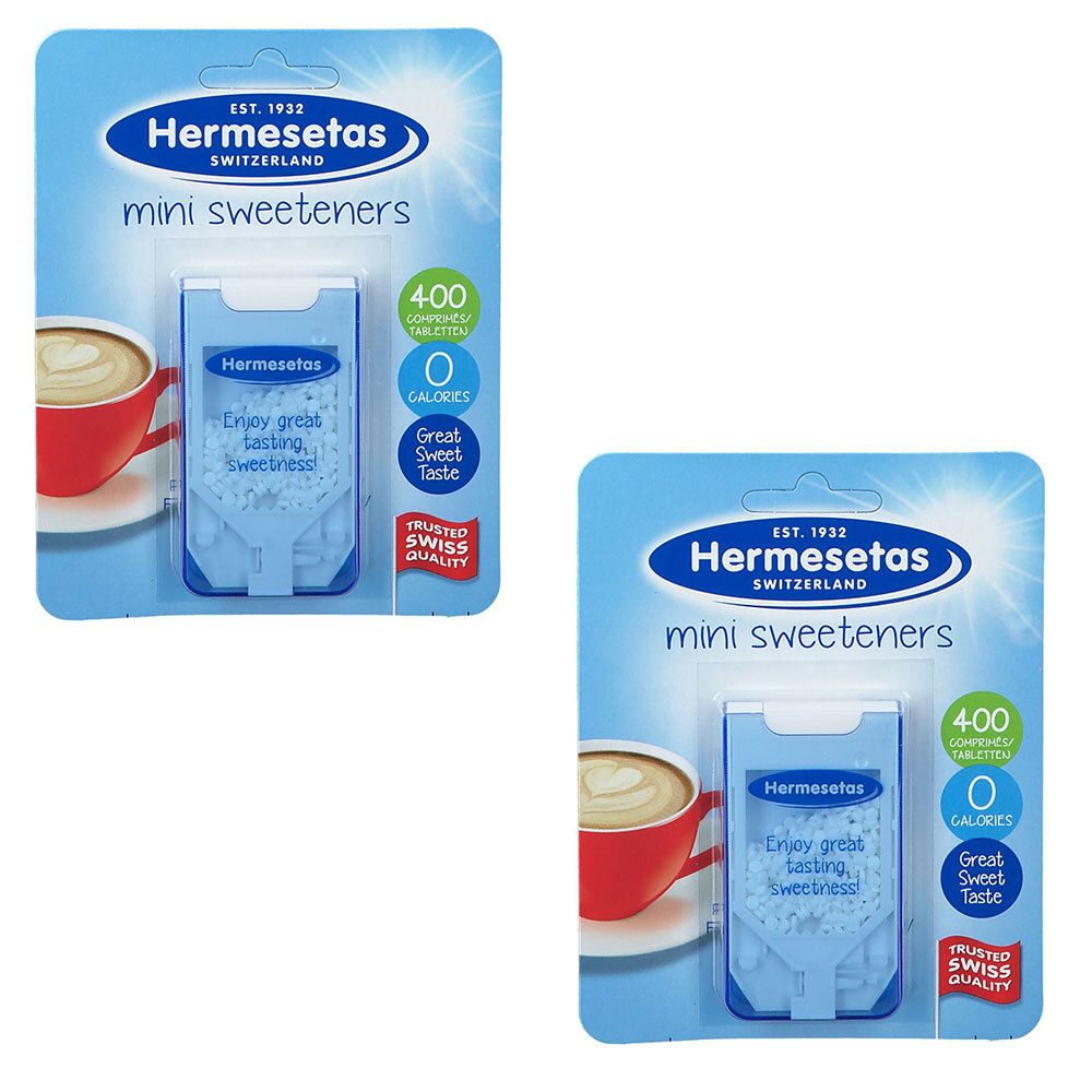 Deux emballages de mini-édulcorants Hermesetas. Emballage bleu avec logo, texte et image d'une tasse de café. Contient 400 comprimés.