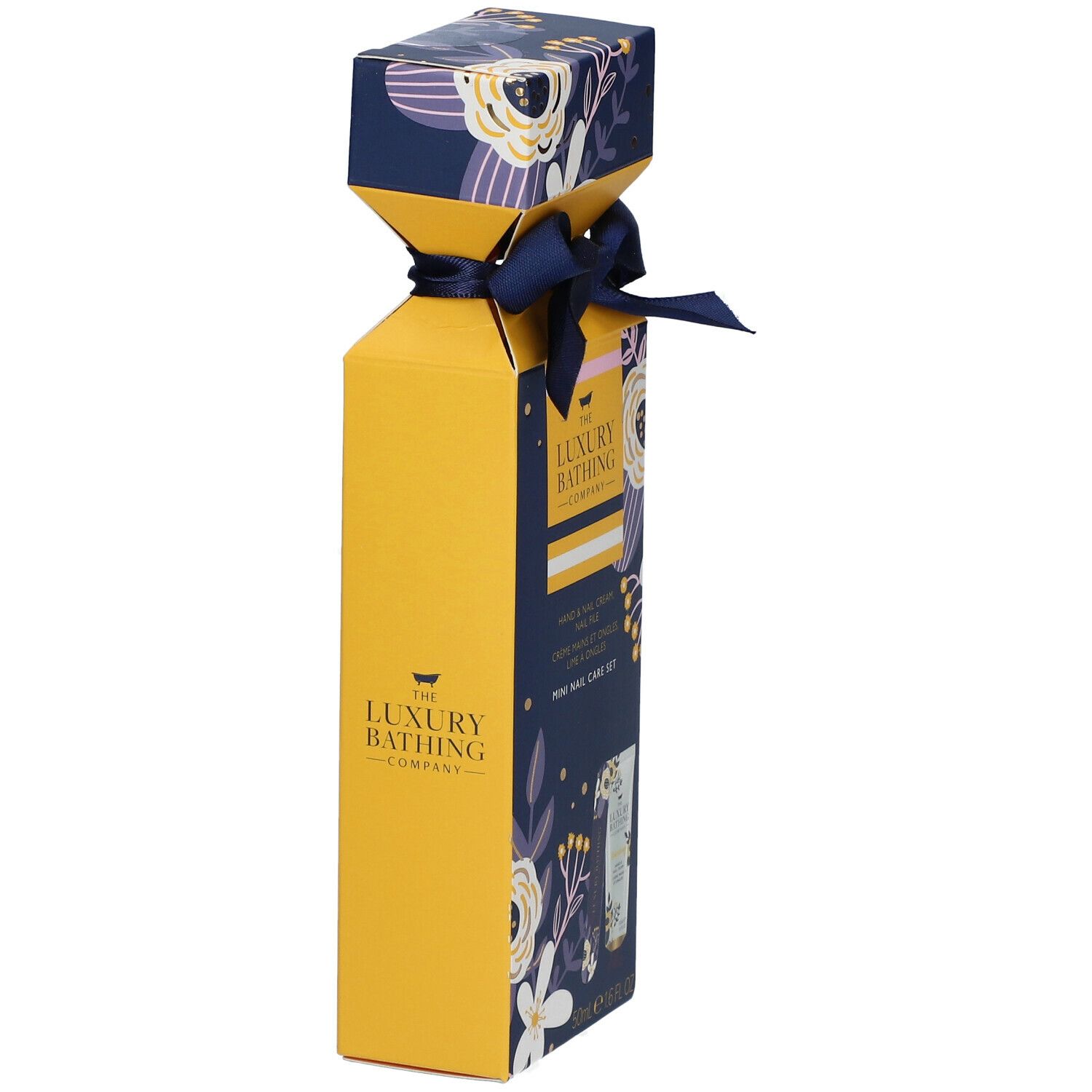 Gele geschenkverpakking met blauw lint. Opdruk: The Luxury Bathing Company. Bloemenpatroon. Mini nagelverzorgingsset.