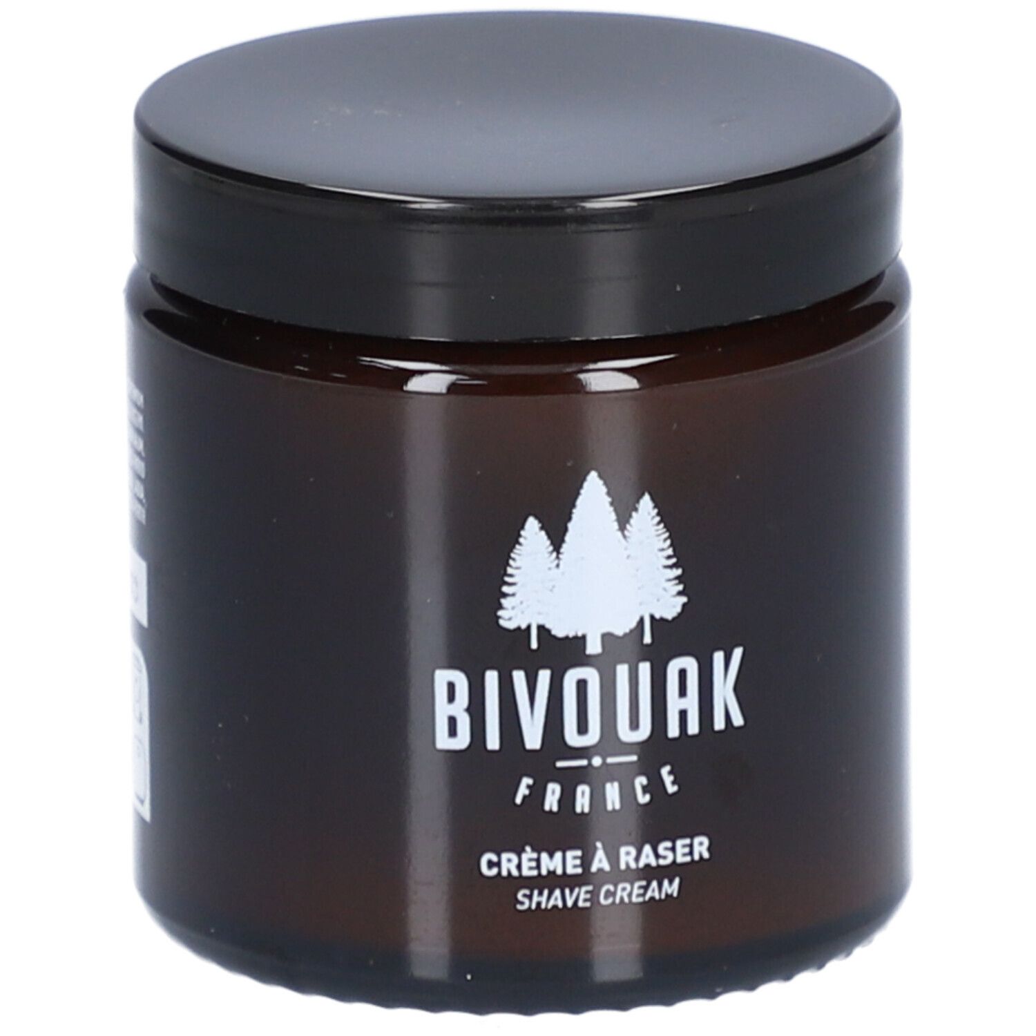Bruine glazen pot met zwarte deksel. Opschrift: BIVOUAK FRANCE, Crème à raser, Shave Cream. Wit logo met bomen.