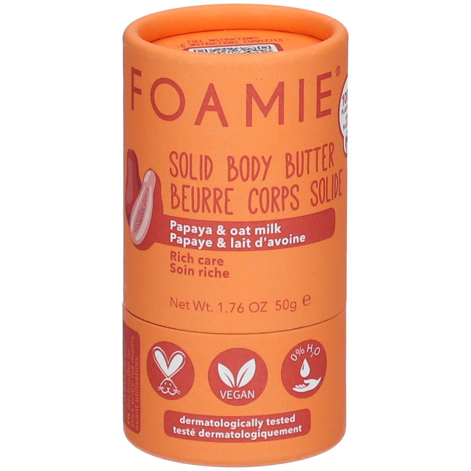 Cilindrische oranje verpakking. Productnaam en papaja-illustratie. Veganistisch zegel. Nettogewicht: 50g.