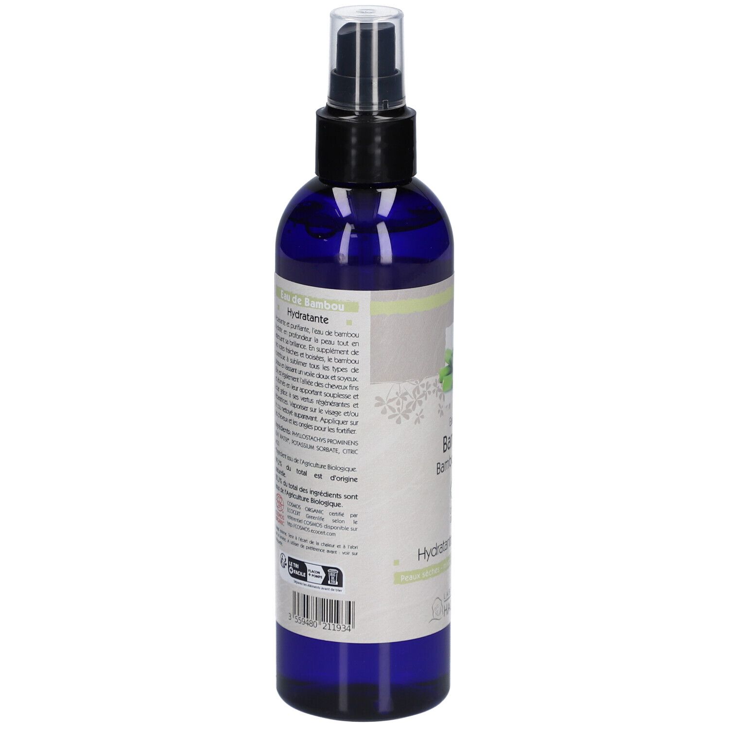 Flacon bleu avec vaporisateur noir. Étiquette avec illustration de bambou et texte: Eau florale Bambou, Hydratante.