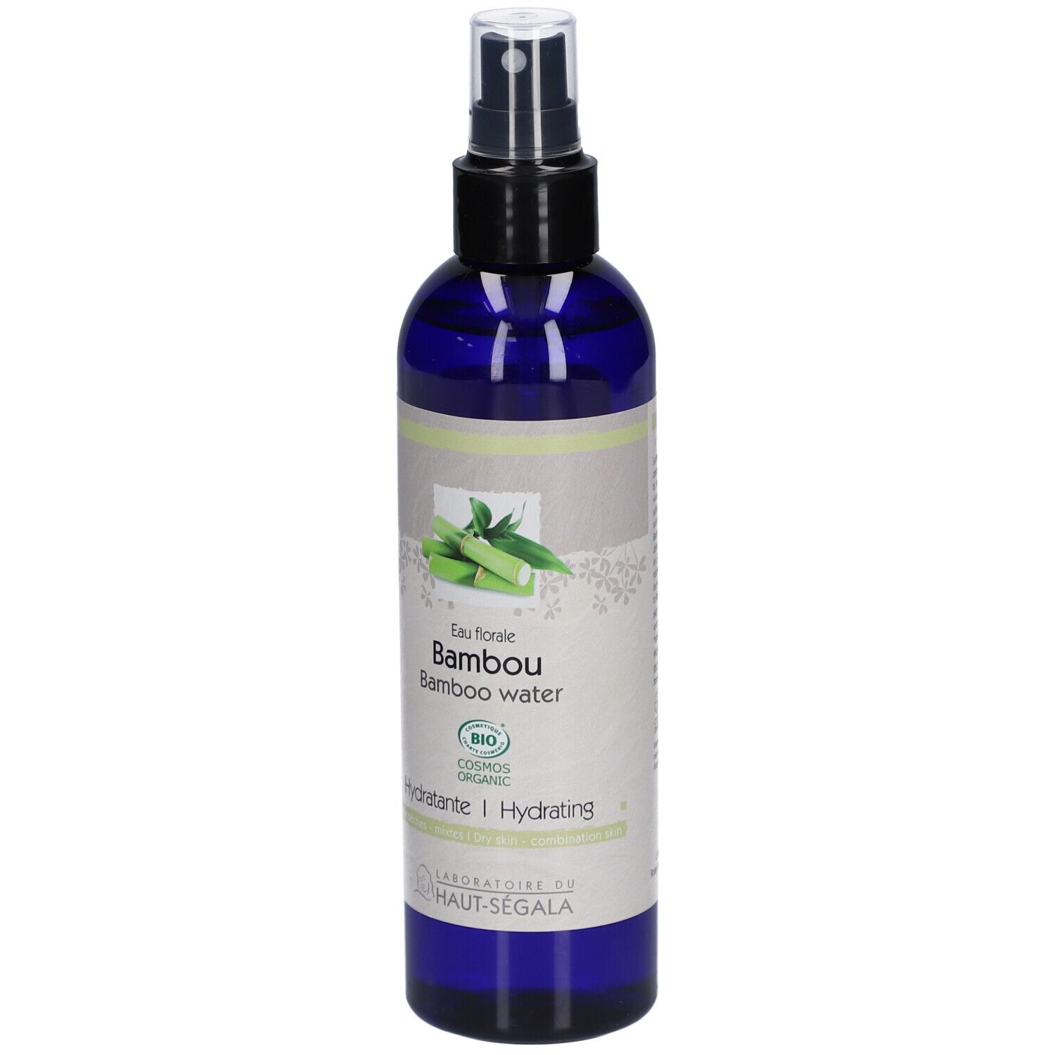 Flacon bleu avec vaporisateur noir. Étiquette avec illustration de bambou et texte: Eau florale Bambou, Hydratante.