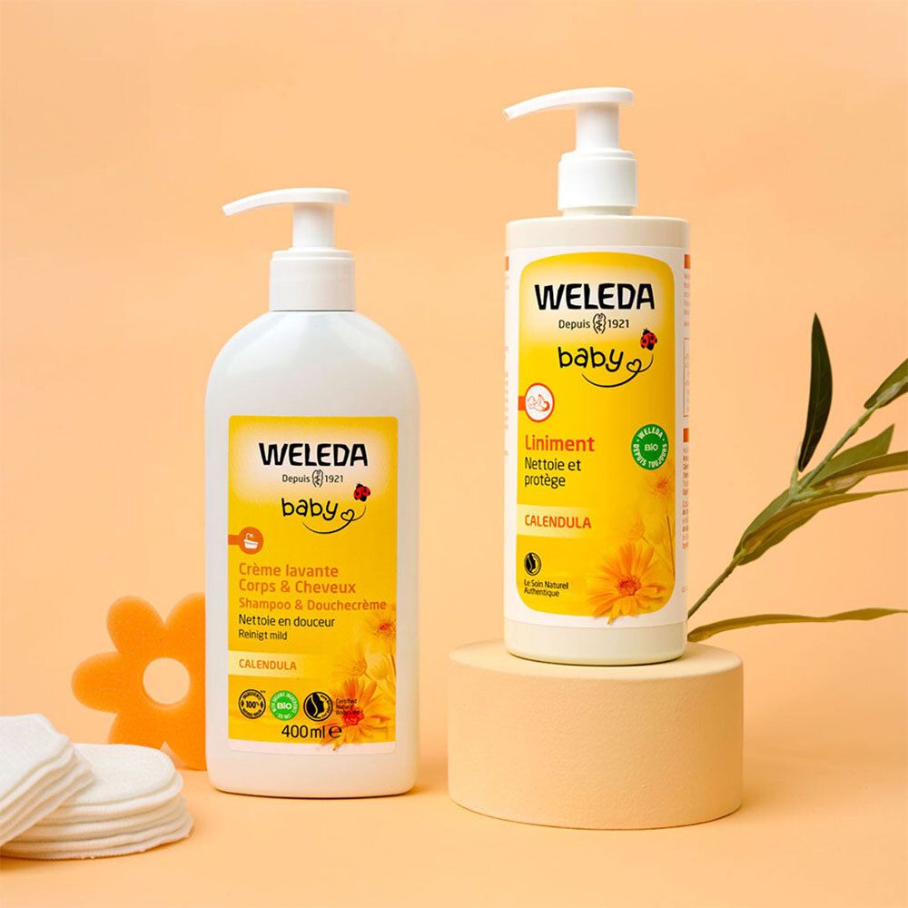 Twee flessen WELEDA Baby producten. Links crème, rechts liniment. Opschrift: Baby, Calendula, Bio.