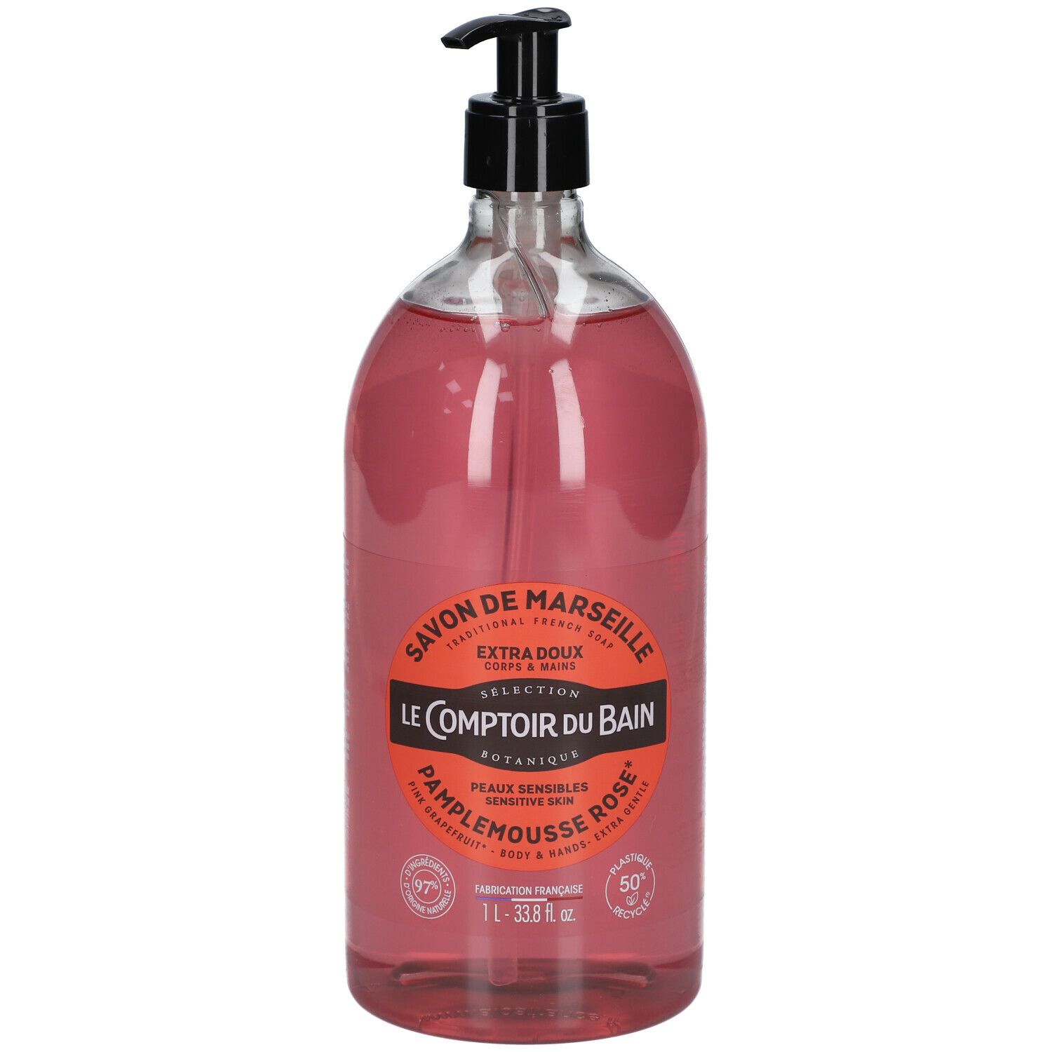 Transparante fles roze vloeibare zeep met zwarte pomp. Etiket met productinformatie.