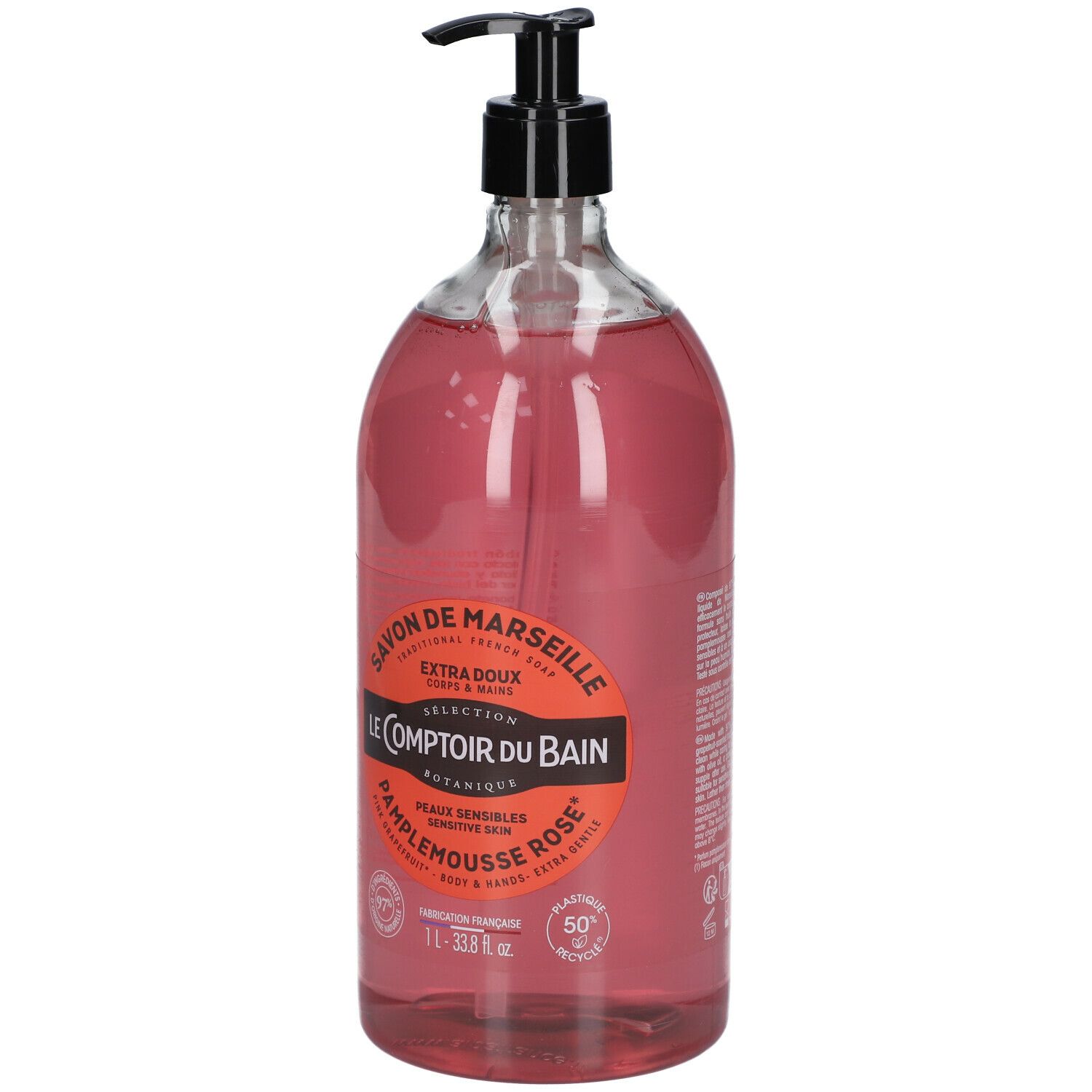Transparante fles roze vloeibare zeep met zwarte pomp. Etiket met productinformatie.