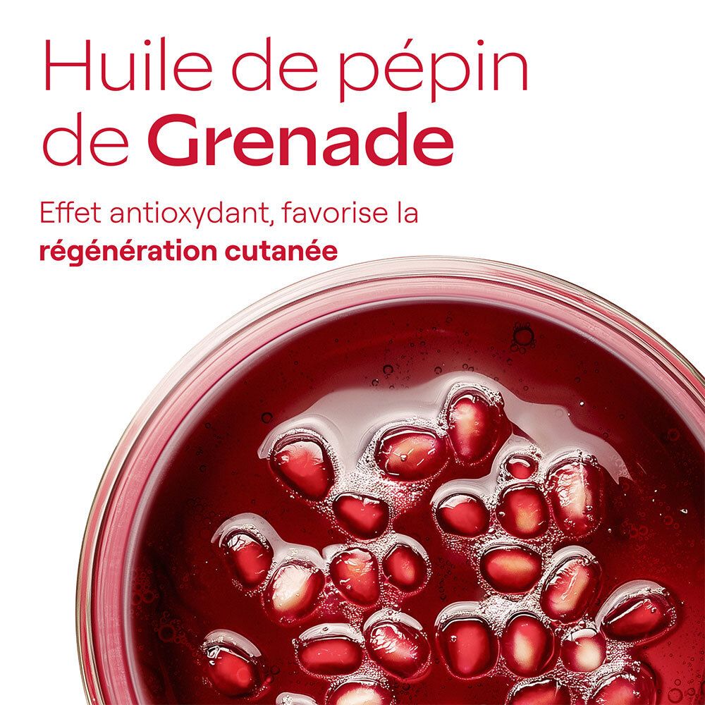 Close-up van granaatappelpitolie. Tekst: Huile de pépins de Grenade. Antioxidant effect, bevordert huidregeneratie.