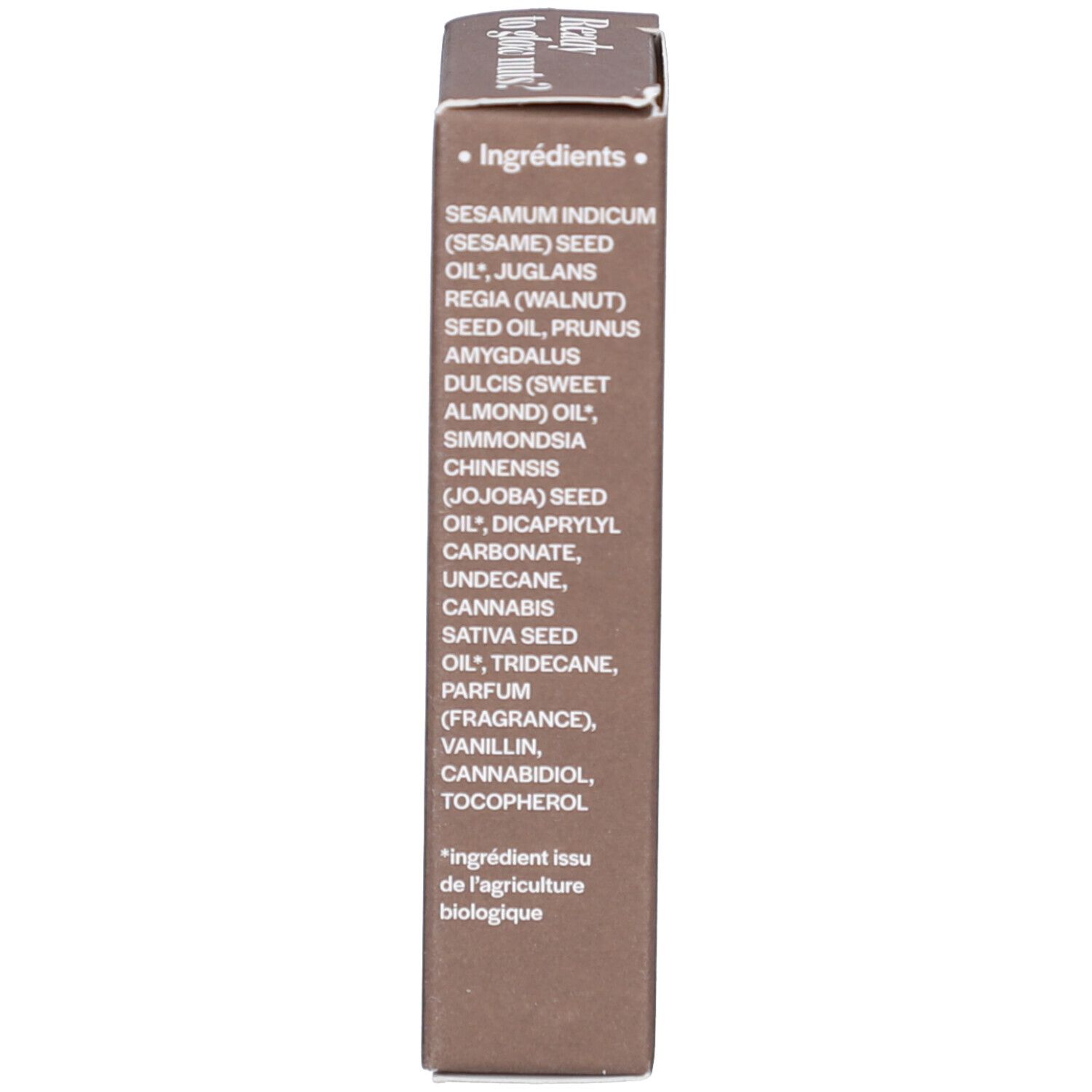 Bruine verpakking. Opschrift: Ingrediënten. Lijst van oliën en ingrediënten. Tekst in het Frans.
