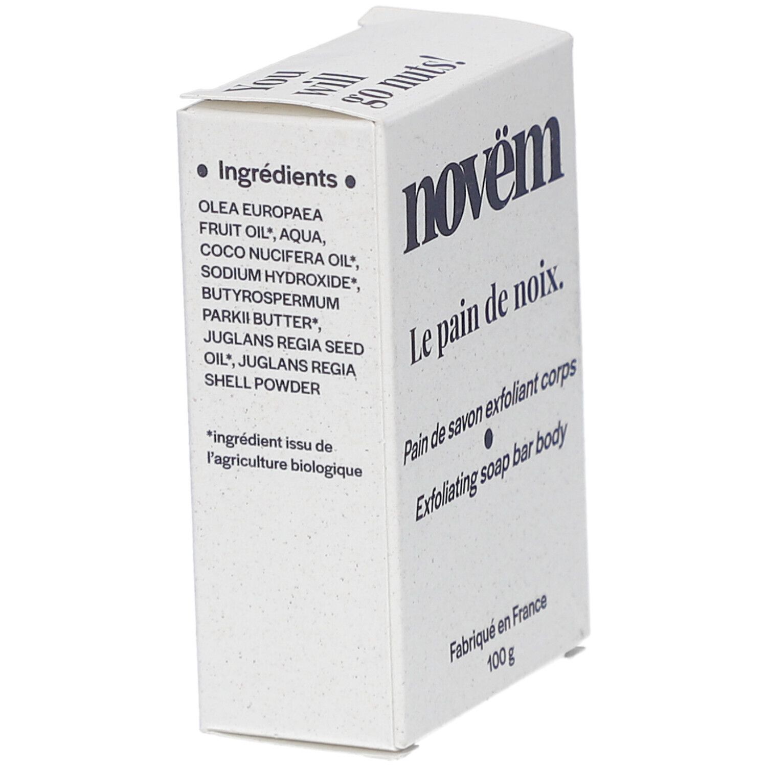 Witte kartonnen verpakking. Opschrift: novëm, Le pain de noix, Ingrediënten, Pain de savon exfoliant corps, Exfoliating soap bar body. Gemaakt in Frankrijk.