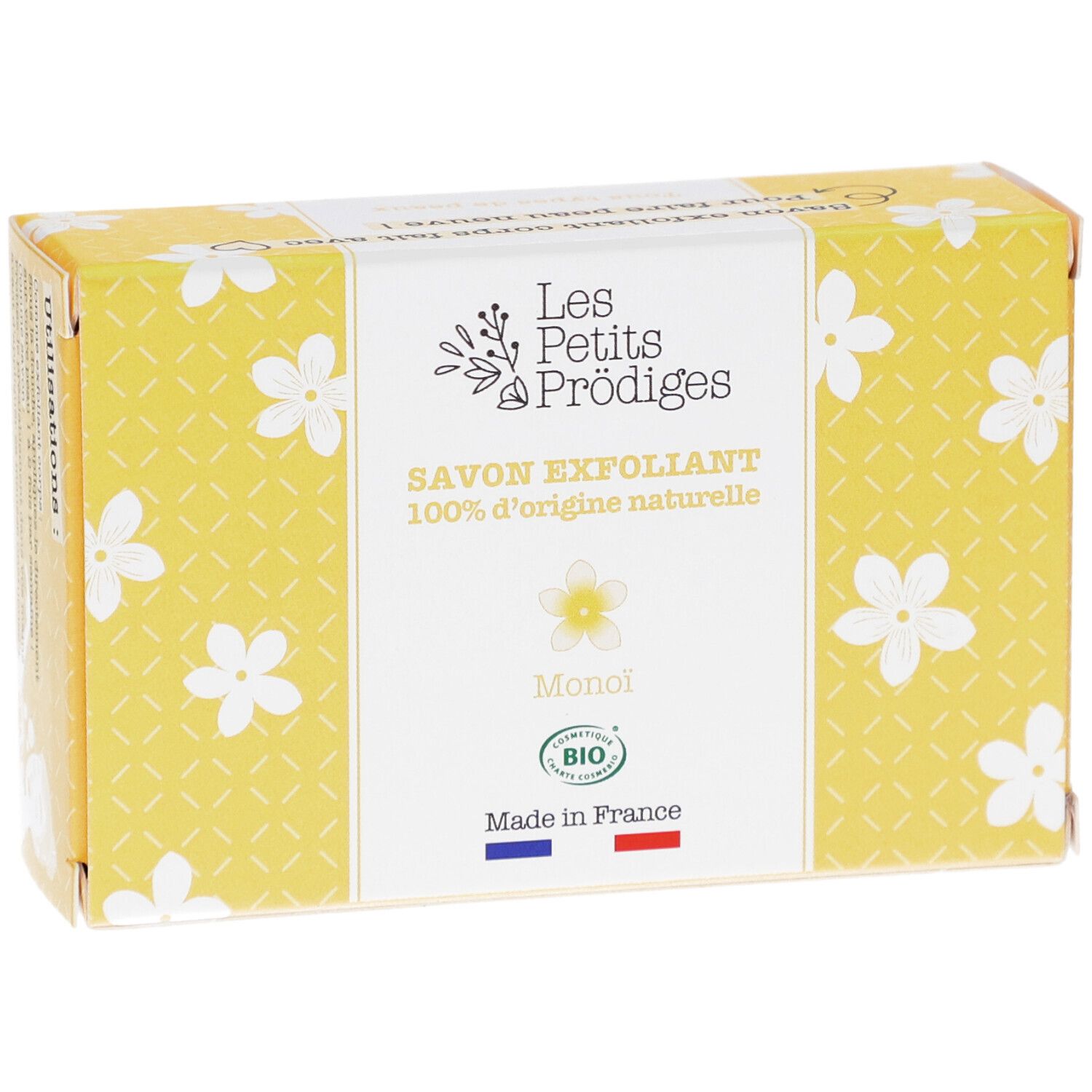 Gele doos met witte bloemmotieven. Opschrift: SAVON EXFOLIANT, 100% d'origine naturelle, Monoi, BIO. Franse vlag.