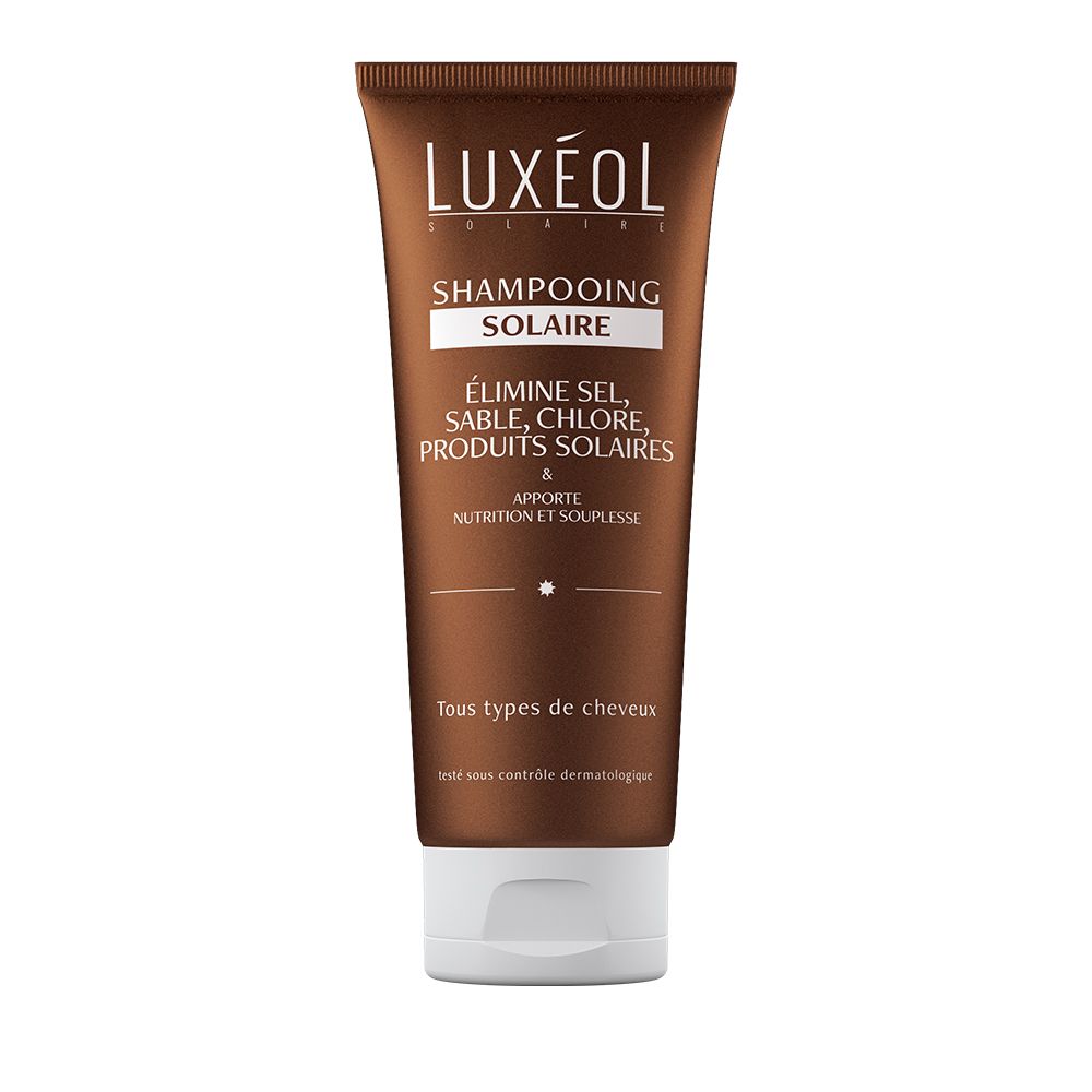 Tube marron avec bouchon blanc. Inscription: LUXÉOL, Shampoing Solaire. Texte: Élimine sel, sable, chlore, produits solaires. Tous types de cheveux.