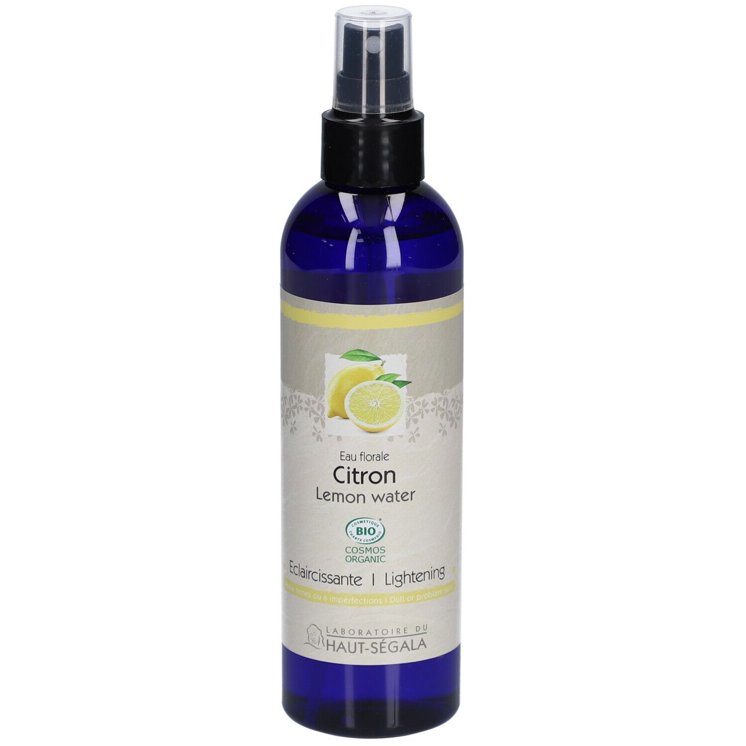 Flacon bleu avec vaporisateur. Étiquette avec citron, texte: Eau florale Citron, Lemon water, Eclaircissante/Lightening, Bio.