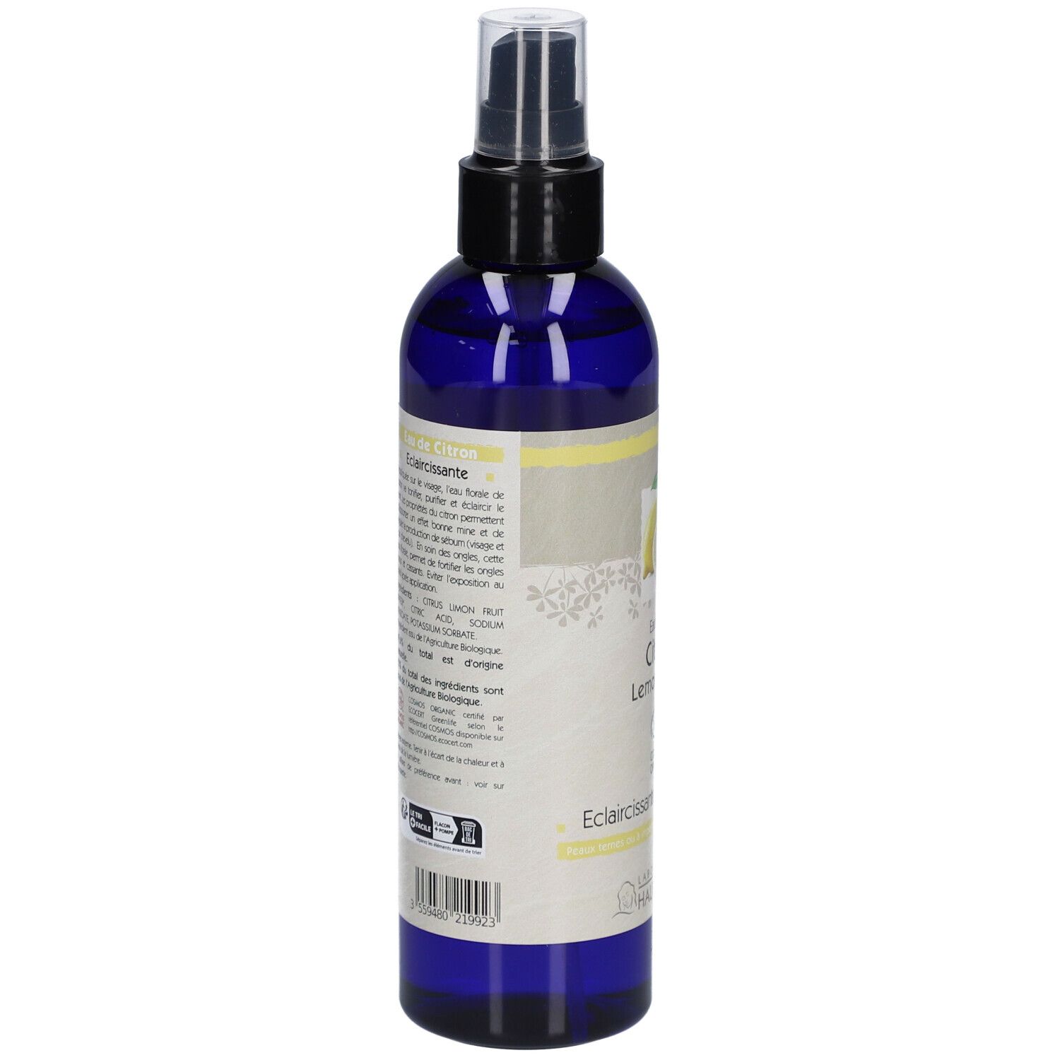 Flacon bleu avec vaporisateur. Étiquette avec citron, texte: Eau florale Citron, Lemon water, Eclaircissante/Lightening, Bio.