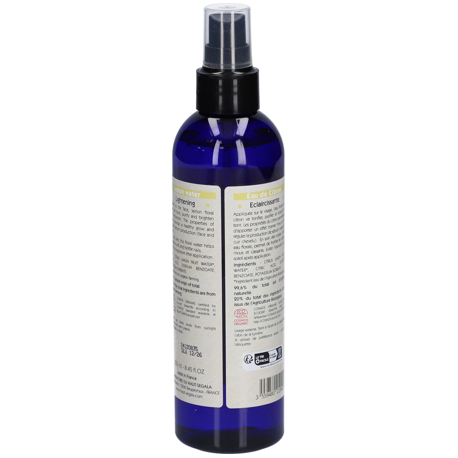 Flacon bleu avec vaporisateur. Étiquette avec citron, texte: Eau florale Citron, Lemon water, Eclaircissante/Lightening, Bio.