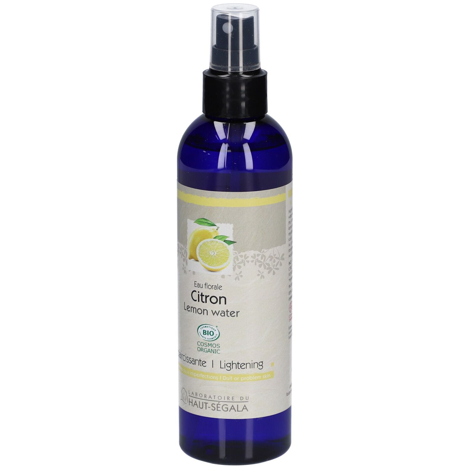 Flacon bleu avec vaporisateur. Étiquette avec citron, texte: Eau florale Citron, Lemon water, Eclaircissante/Lightening, Bio.