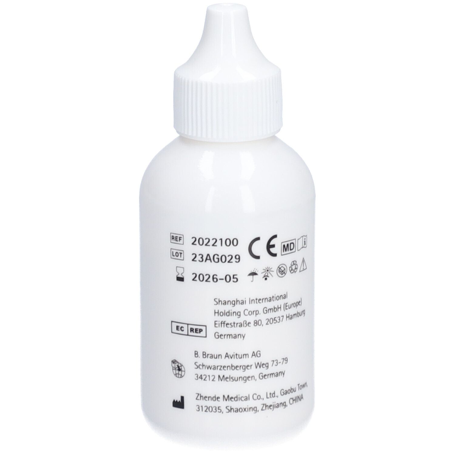 Witte fles. Tekst: REF, LOT, CE, MD, fabrikantenadres. Productinformatie.