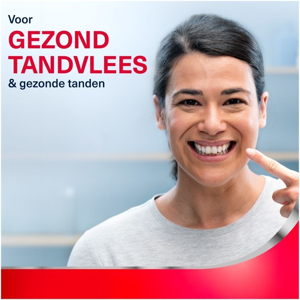 Close-up van tanden, rode bubbels en deeltjes, "Unieke formule".
