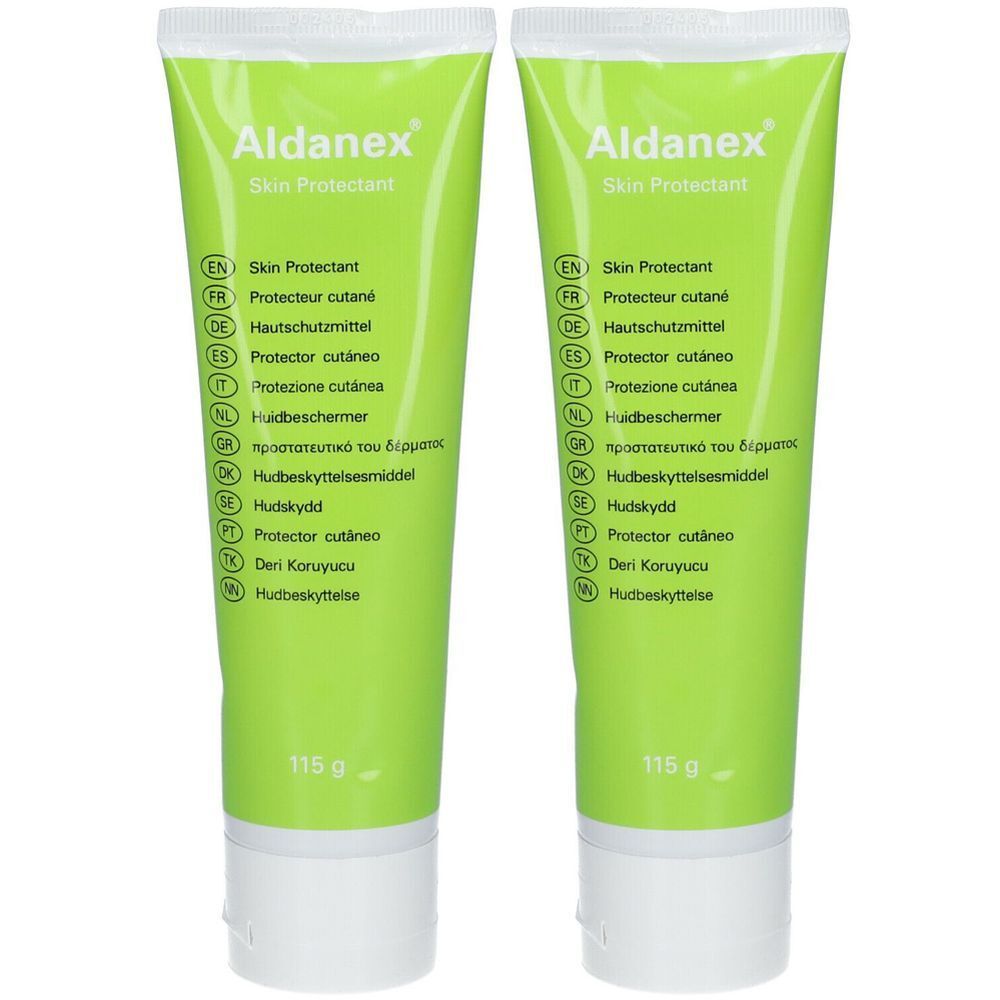 Deux tubes de Aldanex Skin Protectant. Vert et blanc, avec des indications multilingues. Inscription : 115 g.