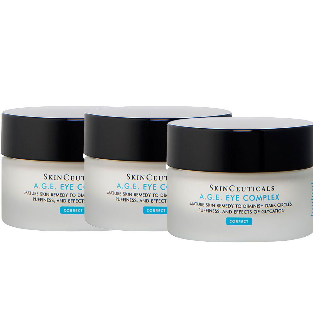 Trois pots de Skinceuticals A.G.E. Eye Complex. Pots blancs avec couvercles noirs. Texte: Mature Skin Remedy to Diminish Dark Circles, Puffiness, and Effects of Glycation.
