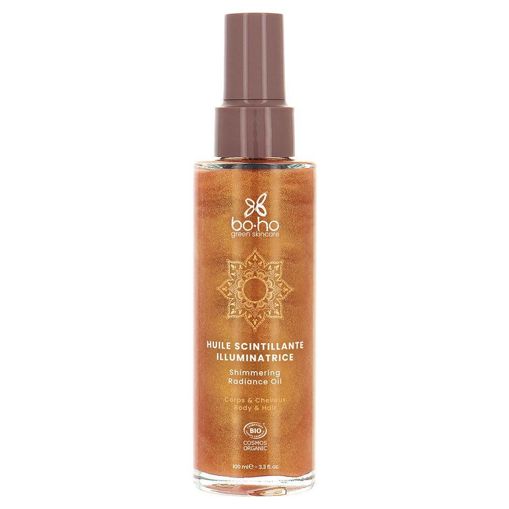 Huile scintillante dans un flacon pulvérisateur. Inscription: Huile Scintillante Illuminatrice, Shimmering Radiance Oil. Certification bio.