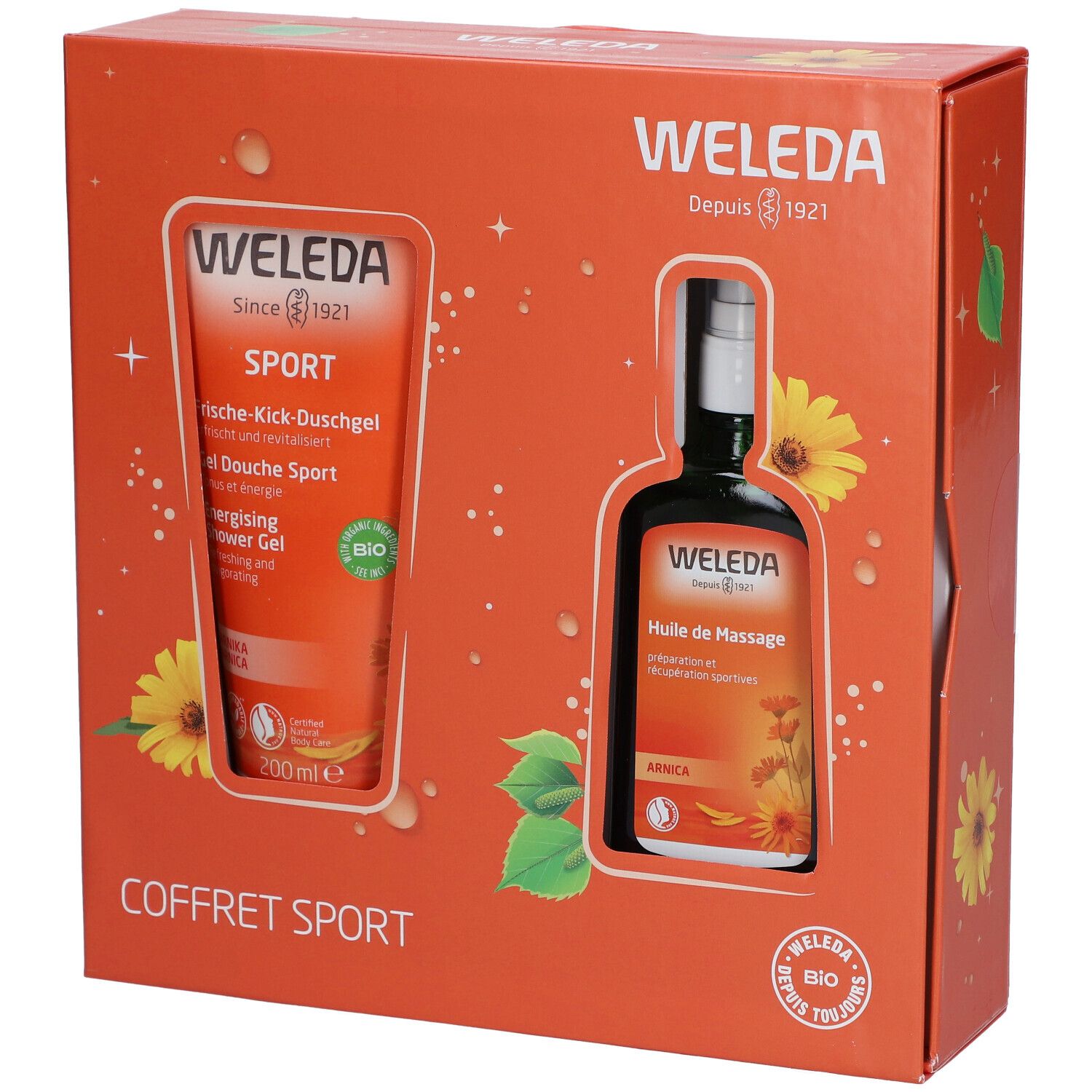 Coffret cadeau orange. Contient un gel douche et une huile de massage. Logos et noms de produits visibles.