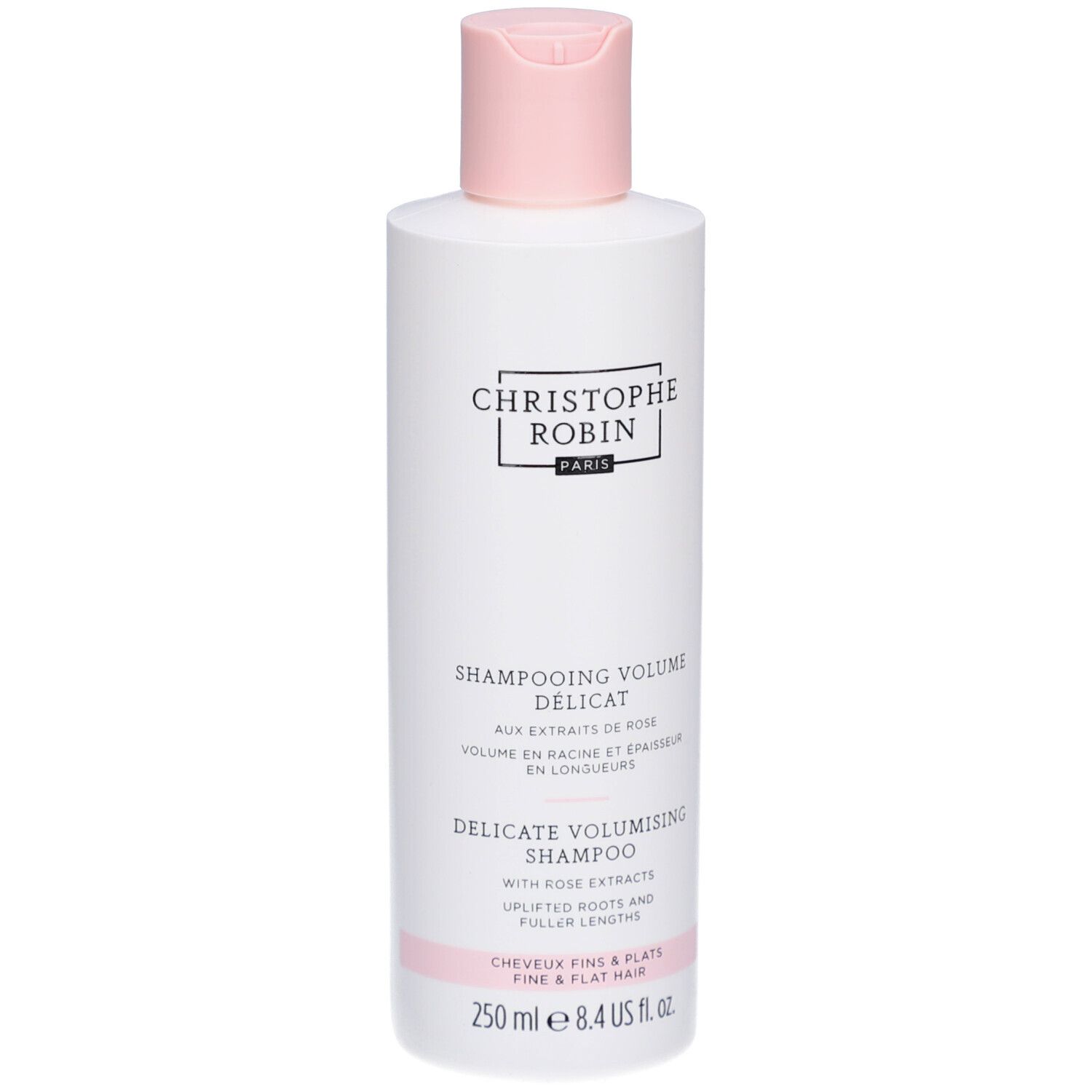 Witte fles met roze dop. Opschrift: Christophe Robin Paris. Tekst: Shampooing Volume Délicat, Delicate Volumising Shampoo.