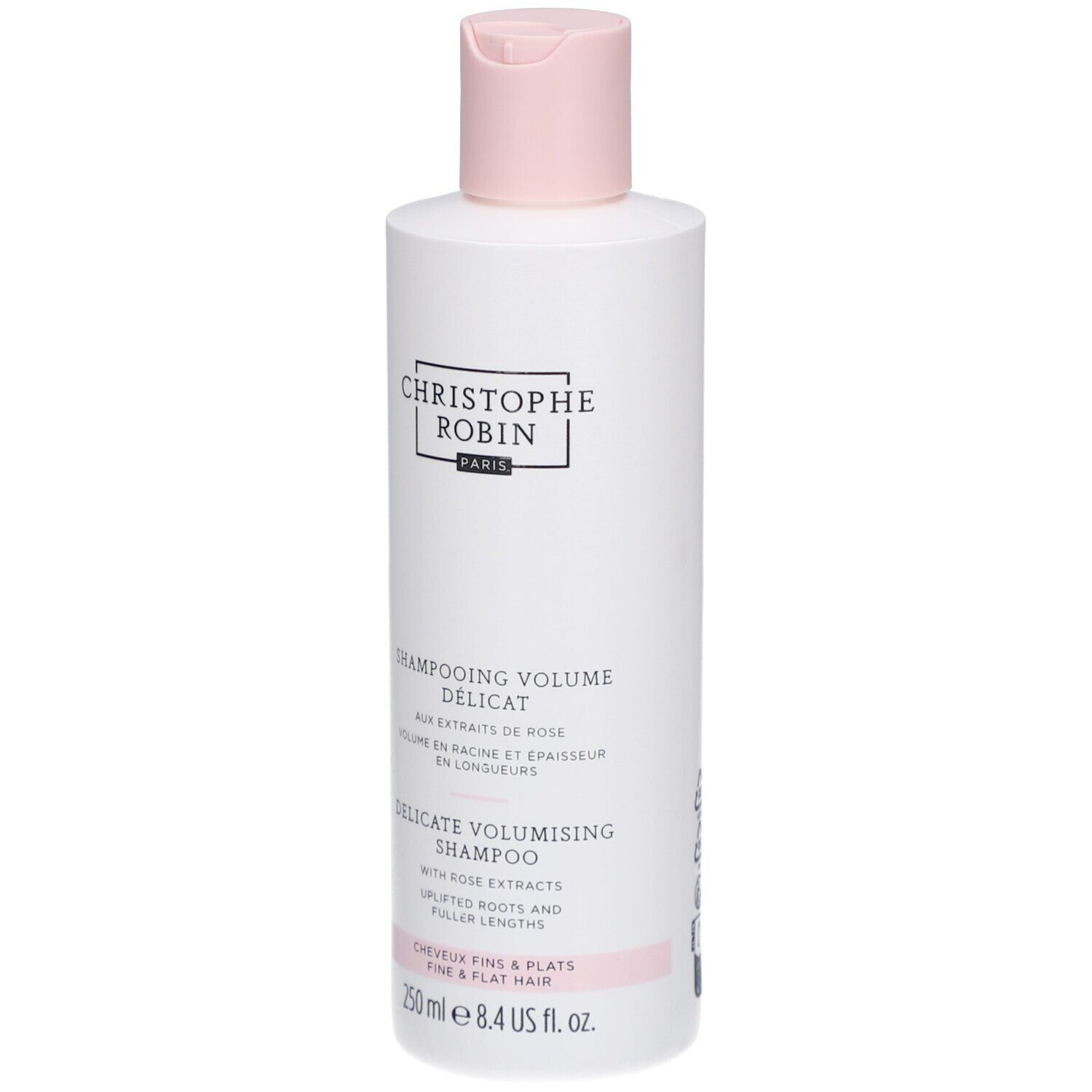 Witte fles met roze dop. Opschrift: Christophe Robin Paris. Tekst: Shampooing Volume Délicat, Delicate Volumising Shampoo.