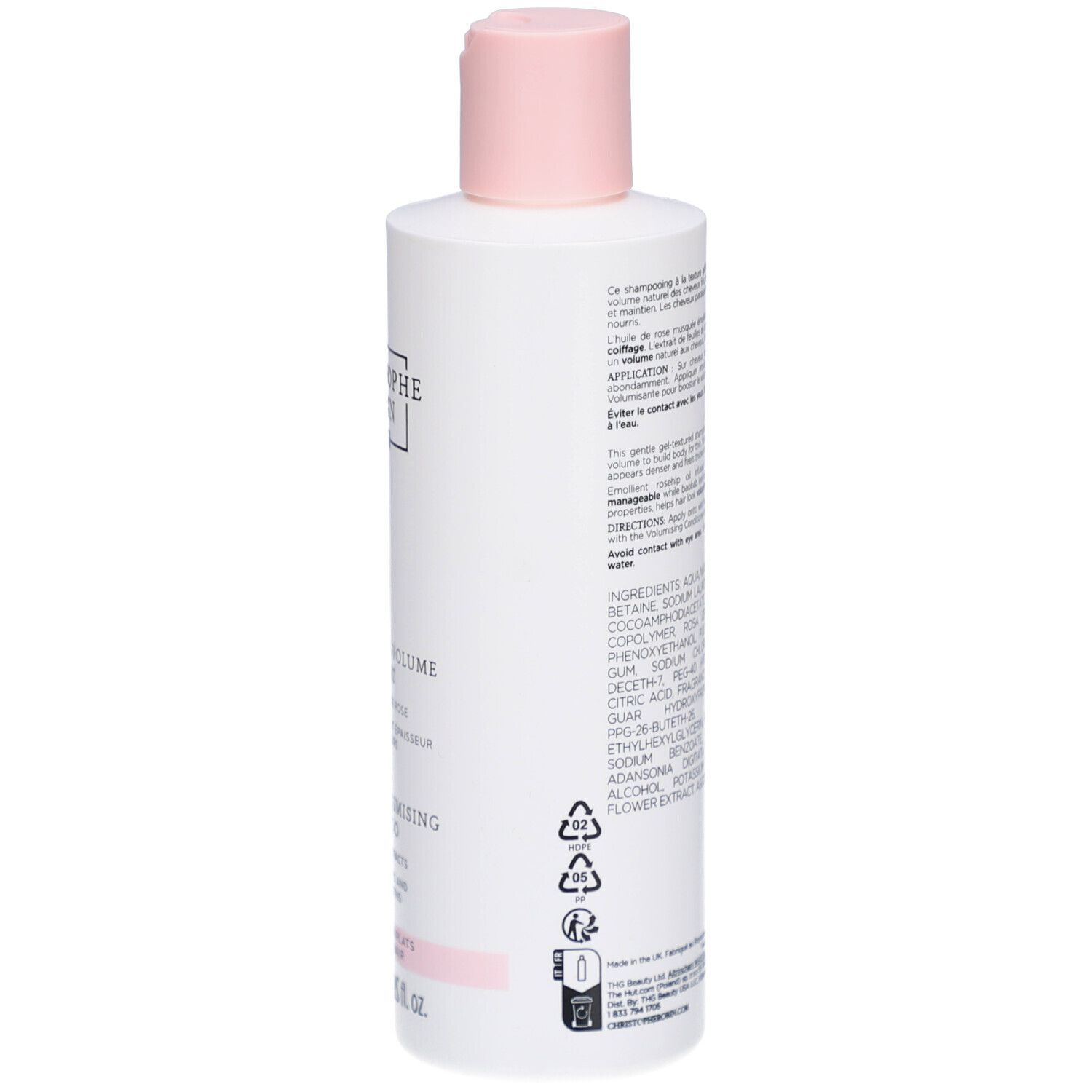 Achterkant van een witte fles met roze dop. Tekst en ingrediënten in meerdere talen. Pictogrammen en productie-informatie.