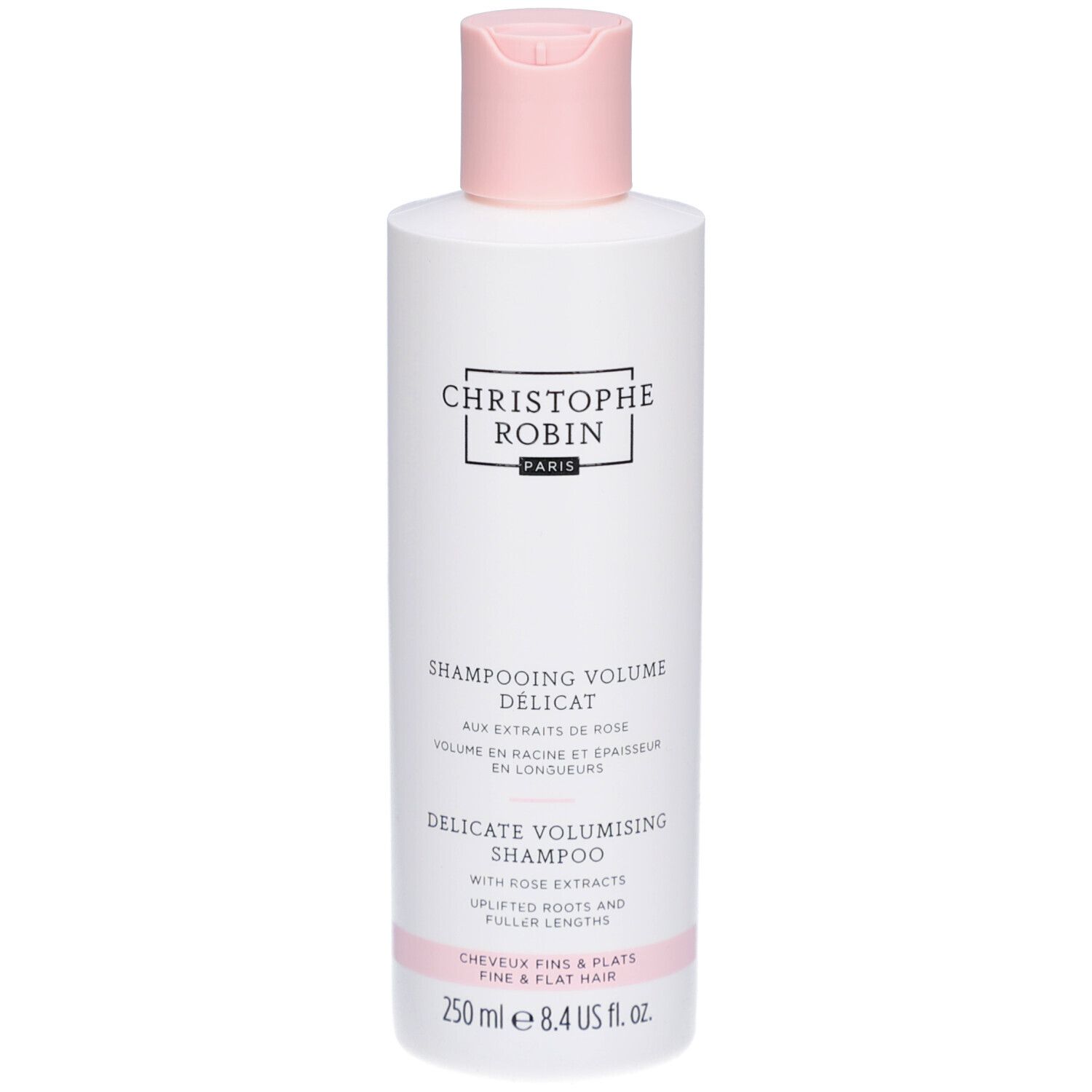 Witte fles met roze dop. Opschrift: Christophe Robin Paris. Tekst: Shampooing Volume Délicat, Delicate Volumising Shampoo.