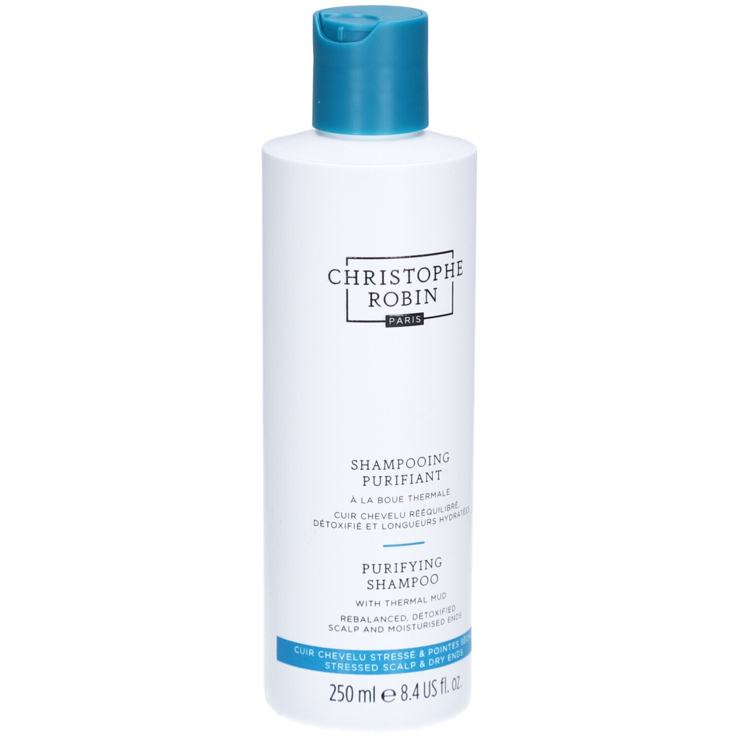 Witte en blauwe shampoo fles. Opschrift: Christophe Robin, Shampooing Purifiant, 250 ml.