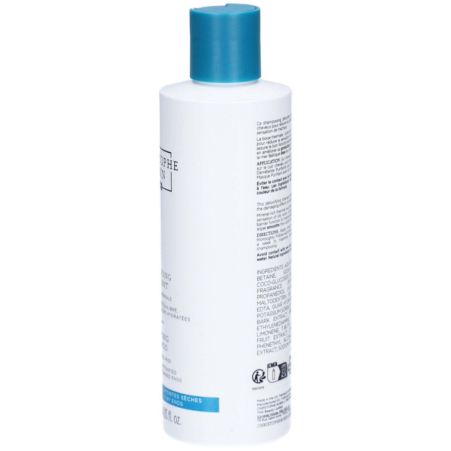 Achterkant van de shampoo fles. Meertalige tekst, ingrediënten en fabrikant informatie.