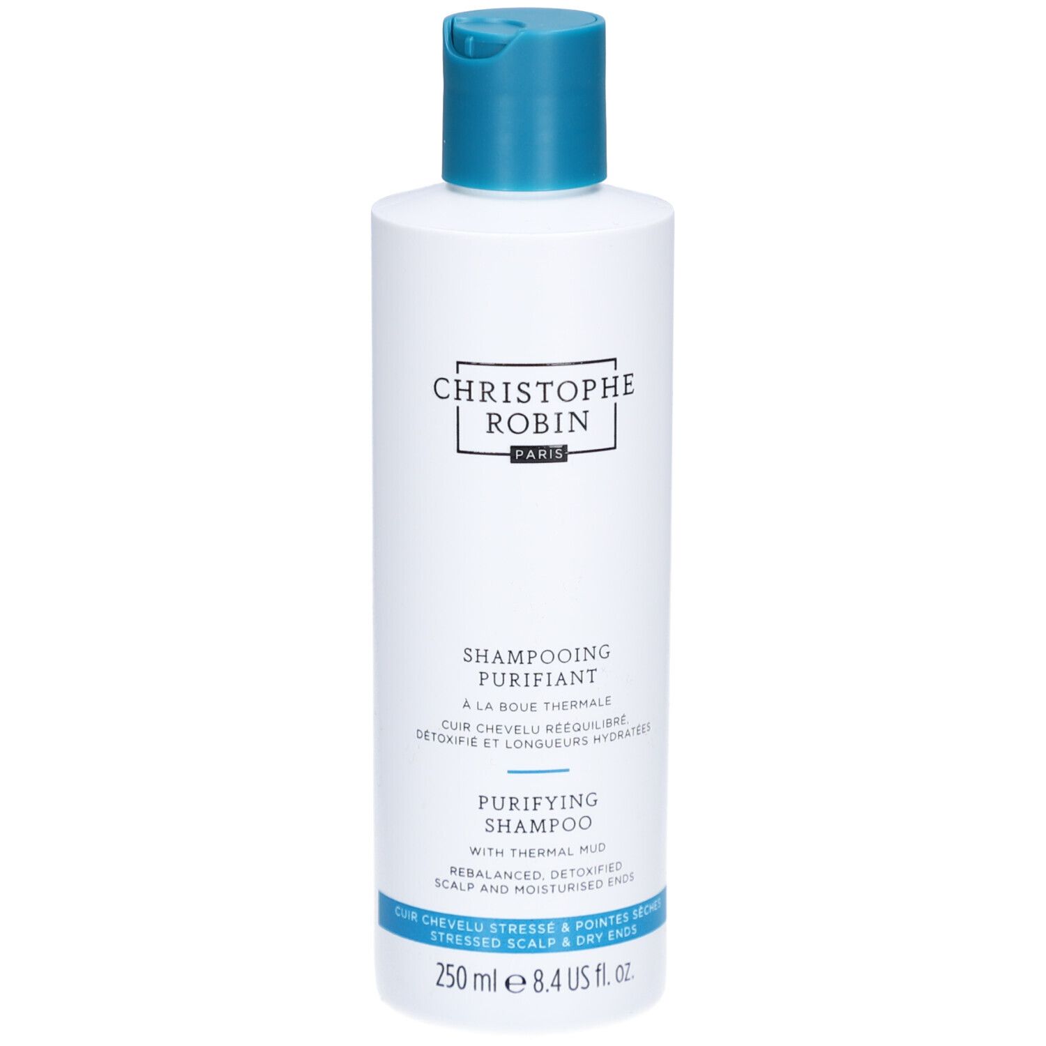 Witte en blauwe shampoo fles. Opschrift: Christophe Robin, Shampooing Purifiant, 250 ml.