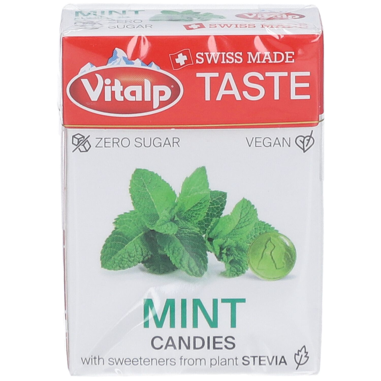 Verpakking Vitalp pepermunt zonder suiker. Opschrift: Swiss Made, Zero Sugar, Vegan. Afbeelding van munt en snoepje.