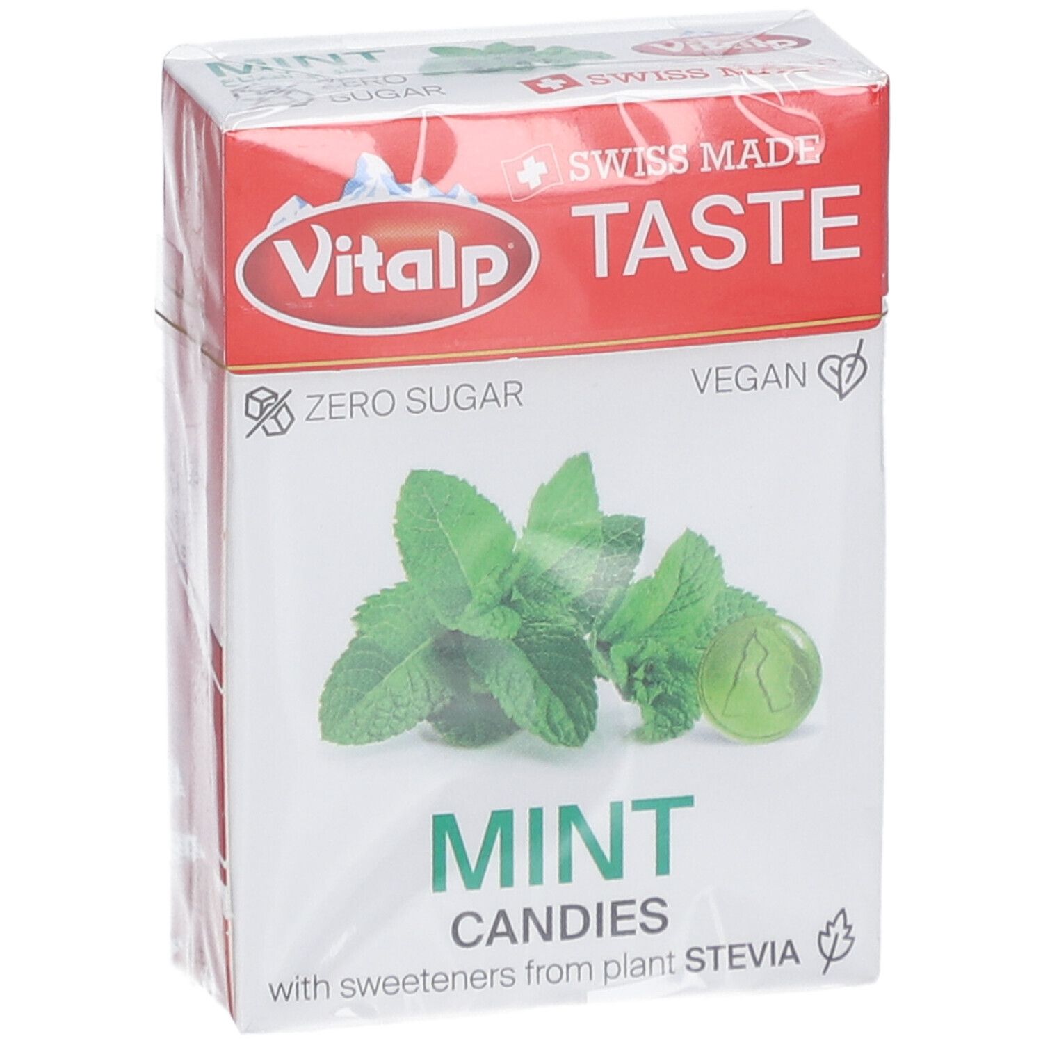 Verpakking Vitalp pepermunt zonder suiker. Opschrift: Swiss Made, Zero Sugar, Vegan. Afbeelding van munt en snoepje.