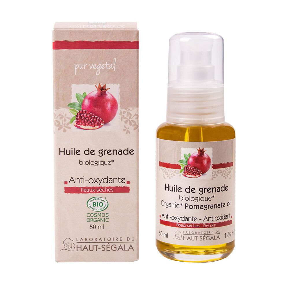 Fles en verpakking granaatappelolie. Opschrift: Huile de grenade biologique, Anti-oxydante, Peaux sèches. Bio-label.