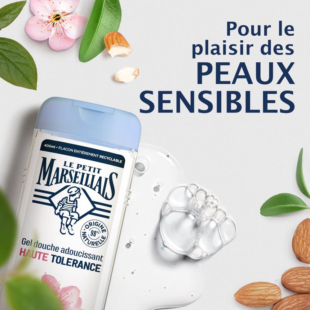 Blauwe fles en zeepbellen. Tekst: Le Petit Marseillais, Gel douche adoucissant Haute Tolérance. Amandelen.