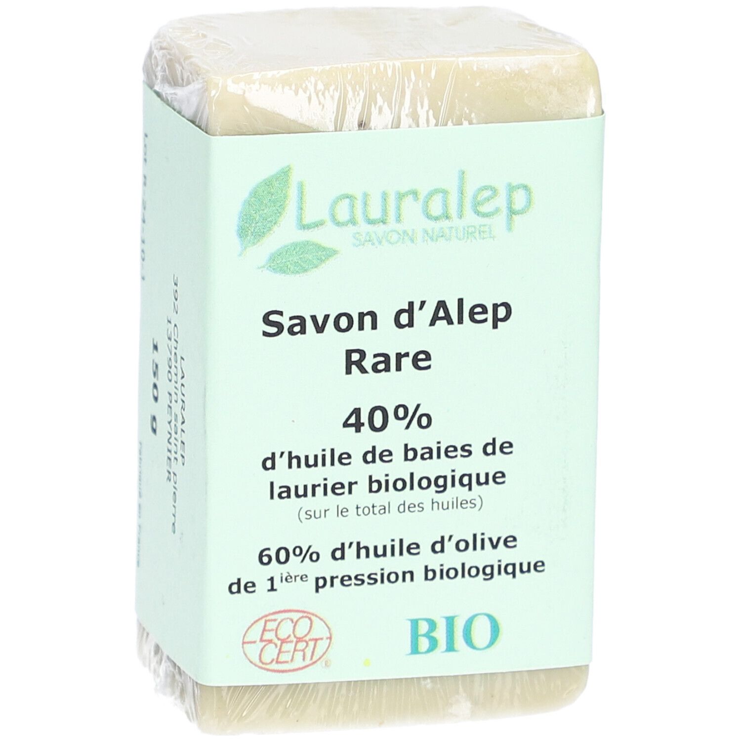 Verpakte zeep met label. Naam, gewicht 150g en bio-certificering. Groenachtige kleur.