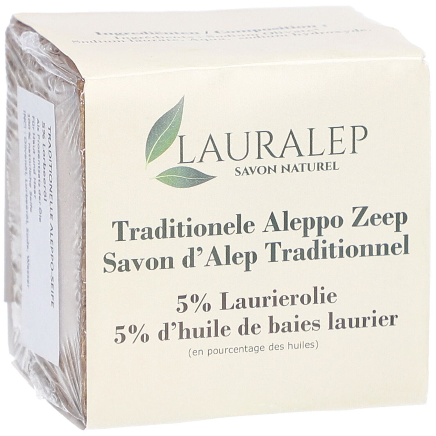 Savon emballé. L'emballage porte LAURALEP, Savon Naturel, Traditionele Aleppo Zeep, 5% Laurierolie.