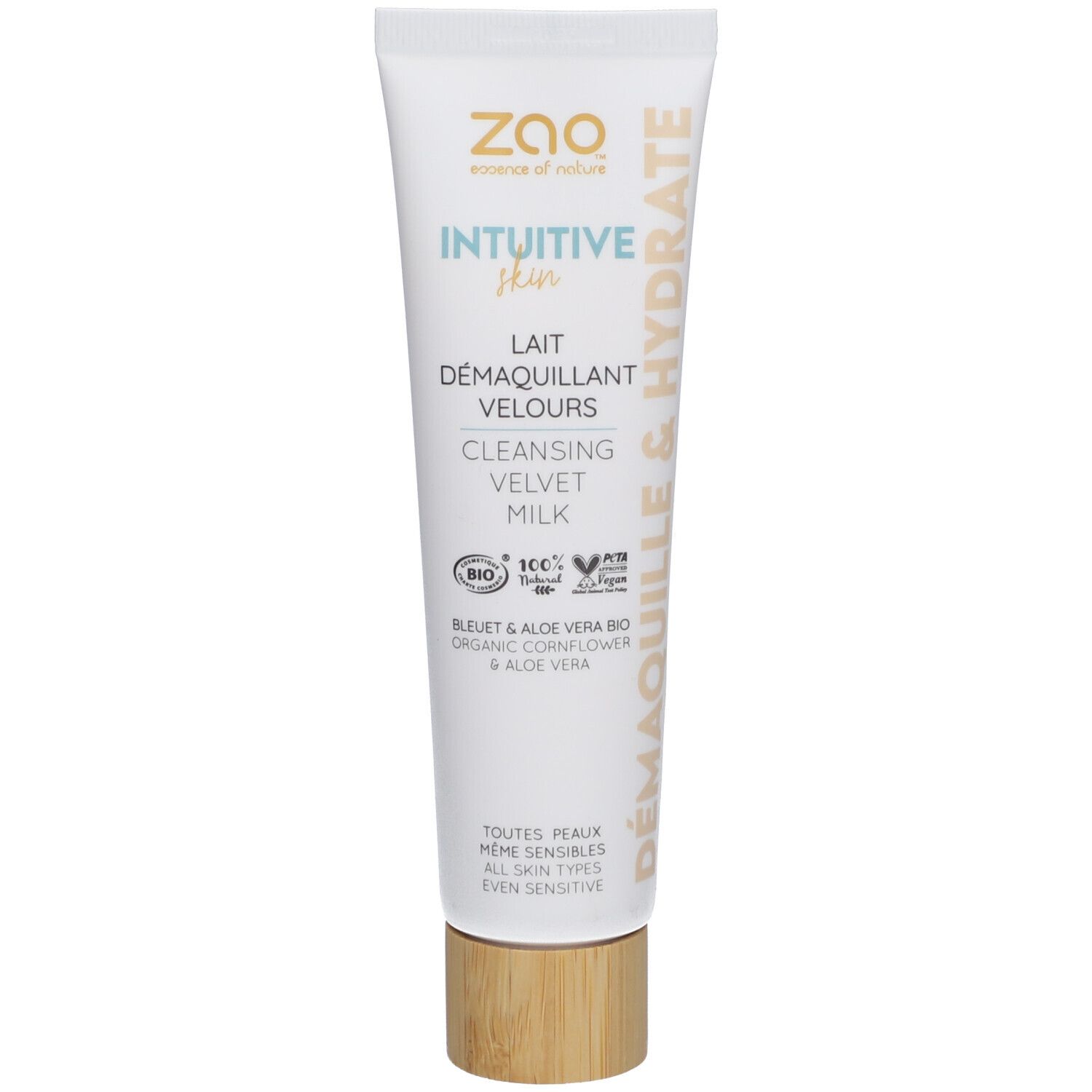 Tube blanc avec nom et logo du produit. Bouchon couleur bois. Texte: Lait Démaquillant Velours, Intuitive Skin, Demaquille & Hydrate.