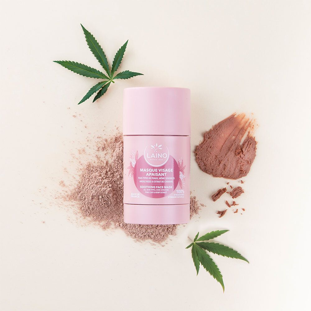 Roze gezichtsmasker stick met cannabisbladeren en maskerpoeder. Opschrift: LAINO, Masque Visage Apaisant.
