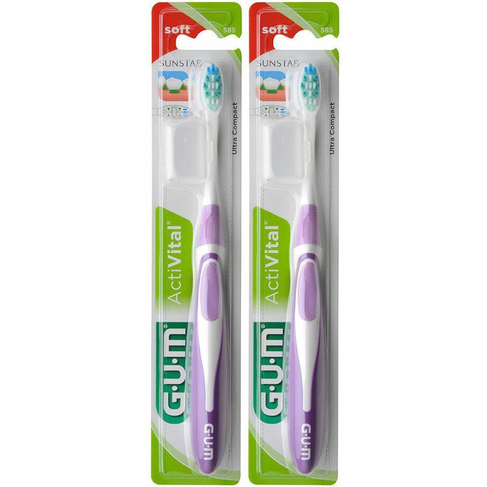 Twee verpakte tandenborstels. Paarse handgreep, witte borstelkop. Merk GUM Activital.