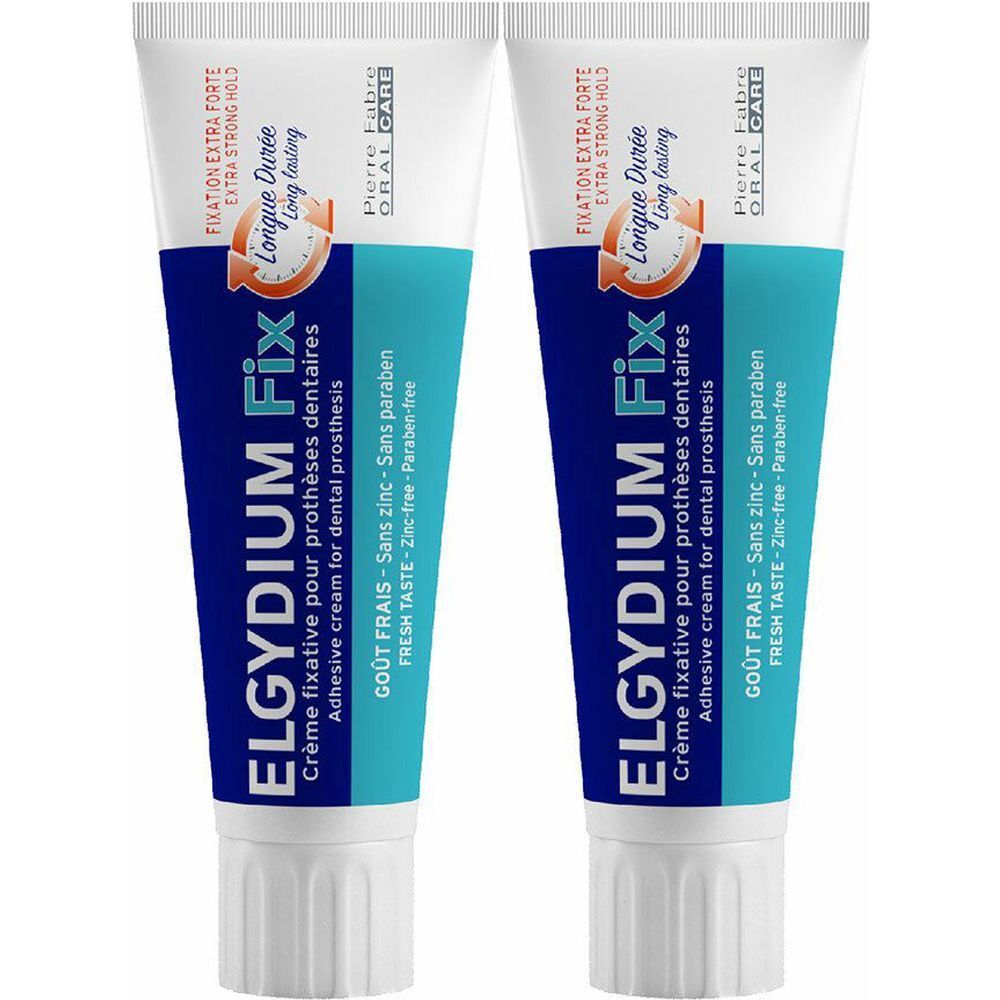 Deux tubes de crème fixative Elgydium Fix pour prothèses dentaires. Emballage bleu et blanc avec texte. "Fixation Extra Forte" et "Longue Durée" sont visibles.