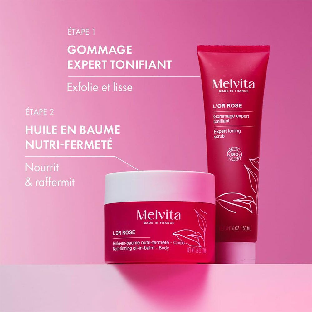 Deux produits: tube et pot Melvita L'Or Rose. Texte: Gommage Expert Tonifiant, Huile en Baume Nutri-Fermeté. Fond rose.