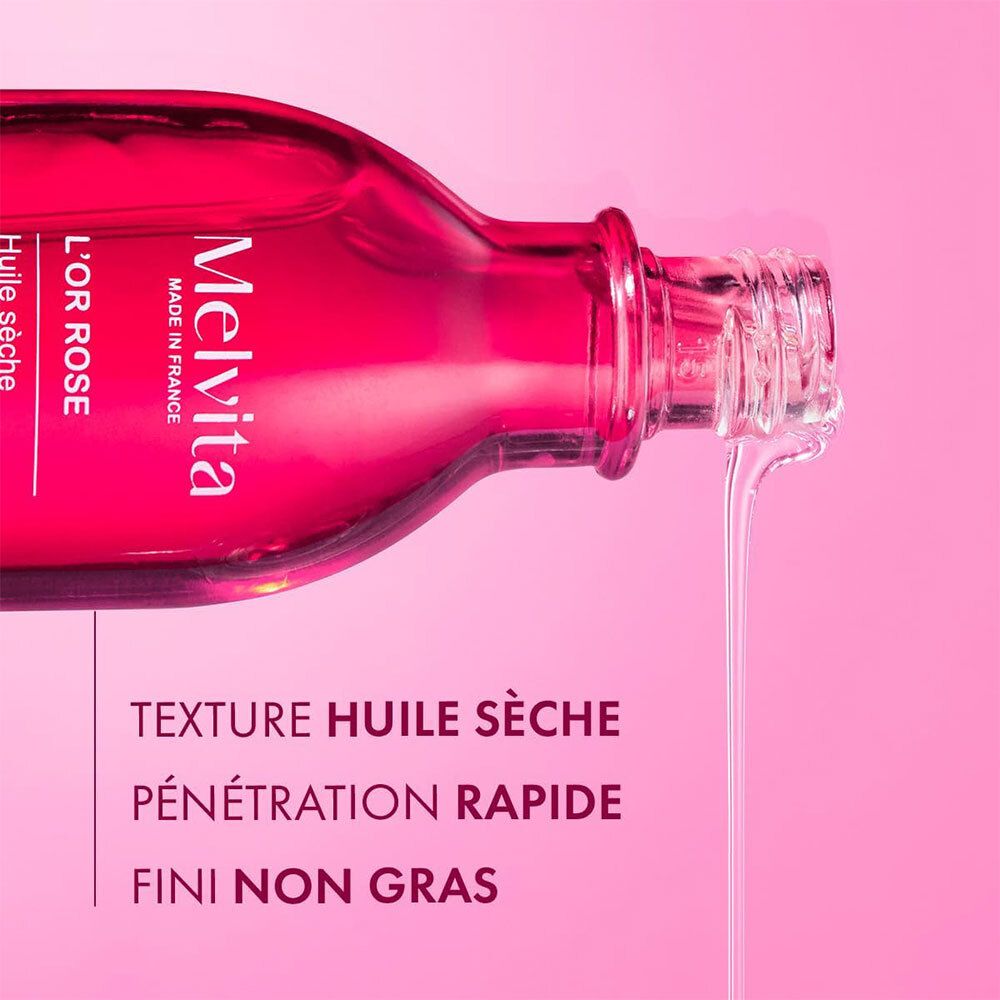Flacon de produit, huile versée. Texte: Texture huile sèche, Pénétration rapide, Fini non gras. Melvita L'Or Rose.