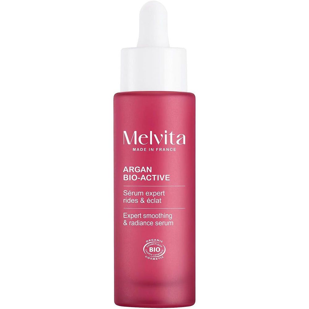 Rode fles met witte dop en pipet. Opschrift: Melvita, Argan Bio-Active, Sérum expert rides & éclat.
