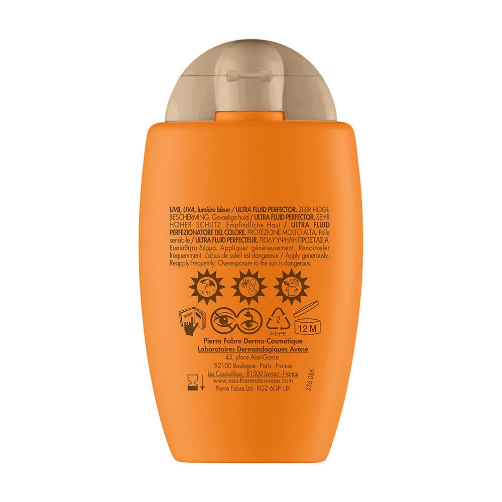 Achterkant van de oranje fles. Tekst: UV, blauw licht, hoge bescherming. Waarschuwingen en fabrikantinfo.