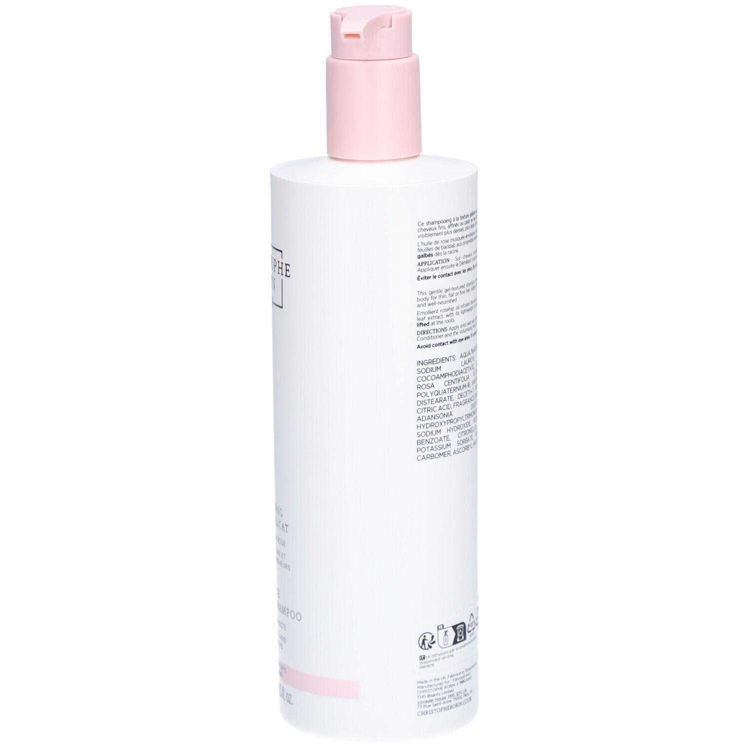 Achterkant van een witte fles met roze pomp. Tekst met ingrediënten en informatie.